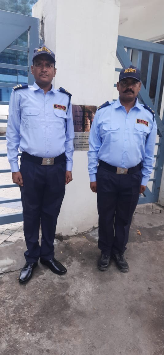 Two HD Manpower Services security guards in uniform